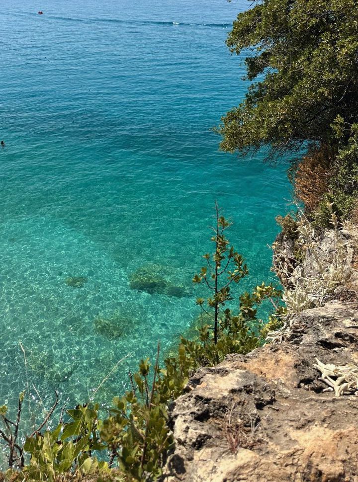 crystal clear water, the rocks are even visible from above at Gjipe Beach Albania