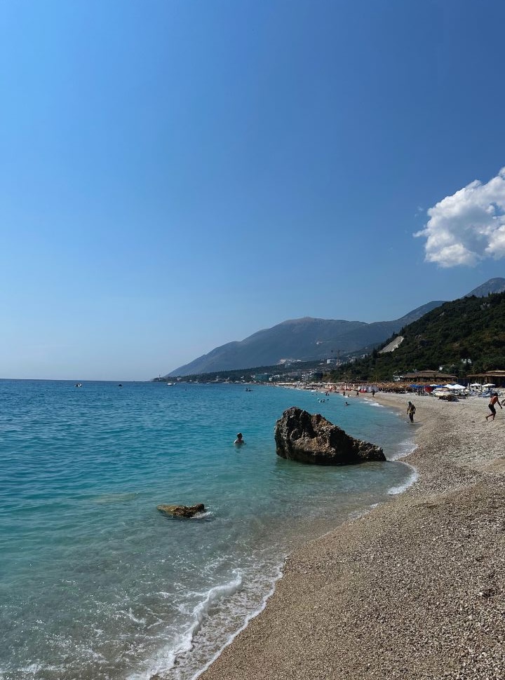 the end of Dhermi beach where there is no crowd, a huge rock is set at the water front ideal to jump of 