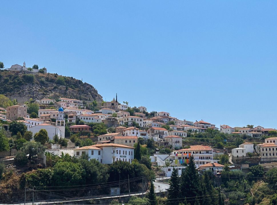 town with old buildings built on the mountain slopes in Dhermi Albania