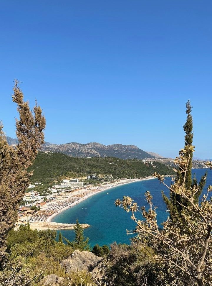 view of Livadhi beach, accomodation and the many sun loungers are visible