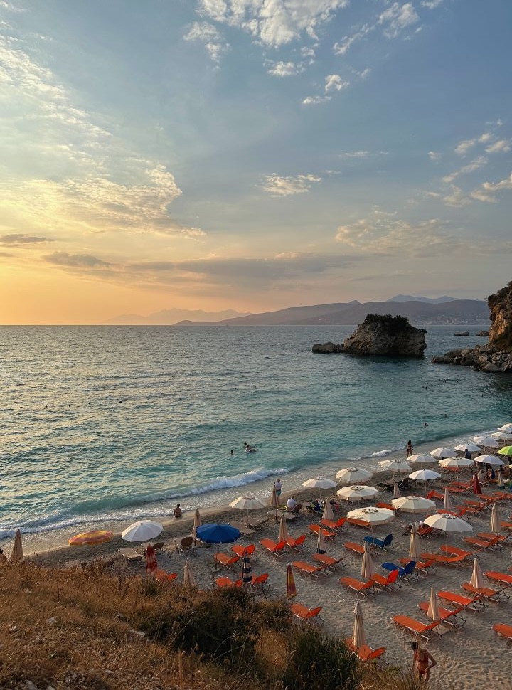 empty sun loungers at Pasqyra beach just before sunset along the Albanian Riviera