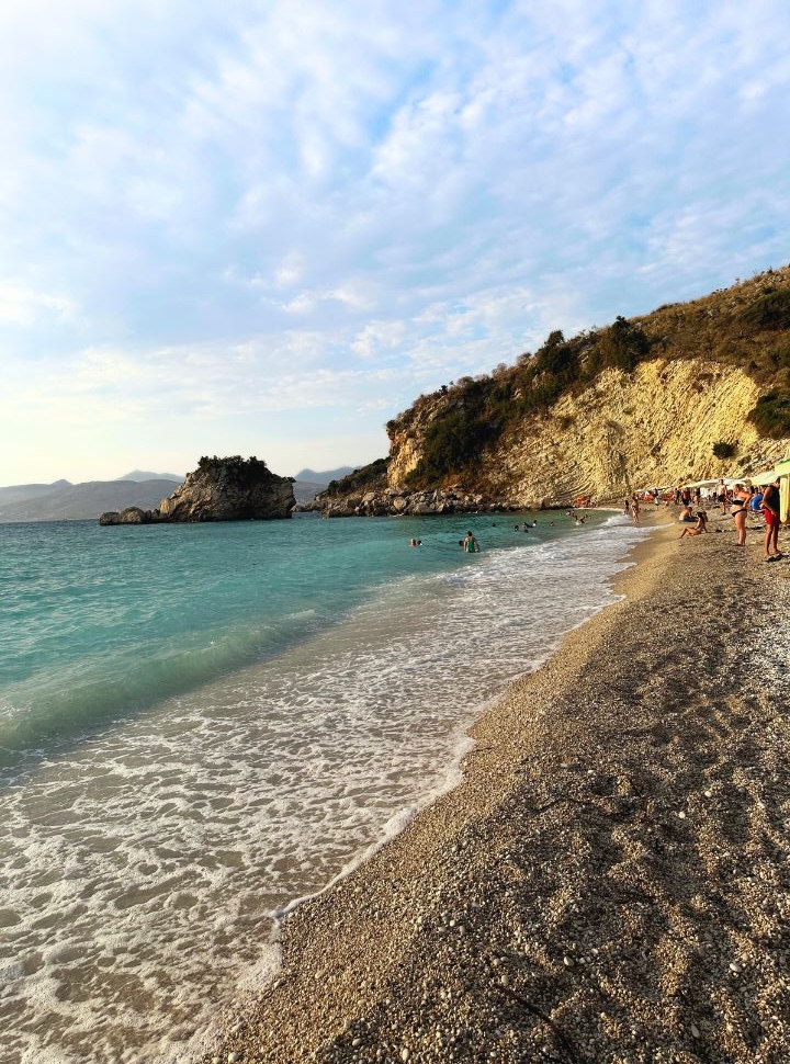 People enjoying the ocean water at Pasqyra beach near Ksamil Albania