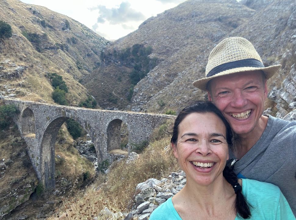 man and woman taking selfie at the Ali Pasha Bridge, an aqua bridge at Gjirokastër Albania