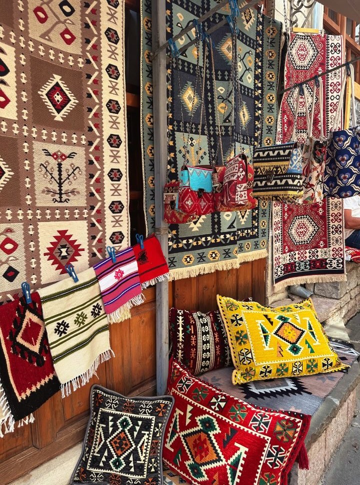 colorful carpets displayed at the old bazaar in Albania