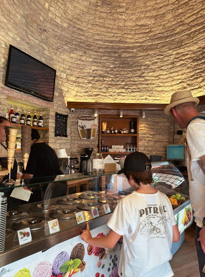 father and son choosing a ice cream flavor in a shop