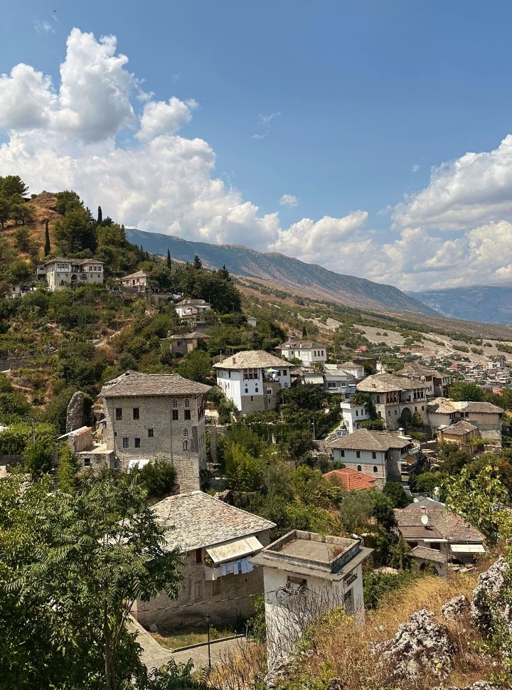 the large ottoman style houses set against the mountain slopes at Gjirokaster Albania