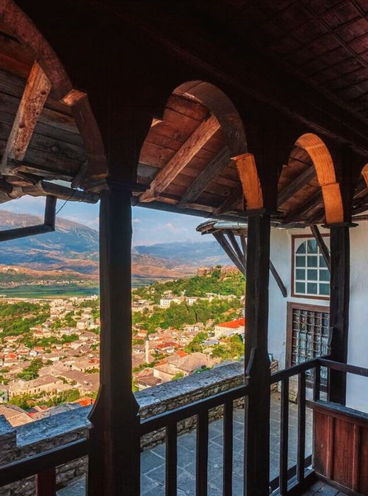 view of the town Gjirokastër and the mountains from the large balcony of the ottoman styled house