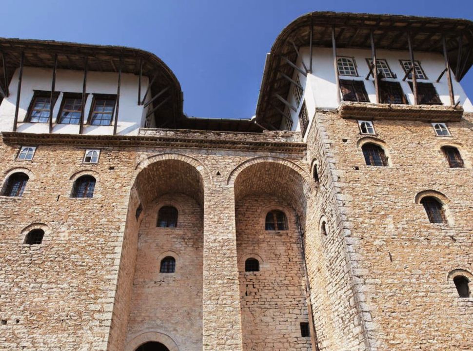 the big ottoman style house with its tall stone walls, and roofs supported by wooden beams in Gjirokastër