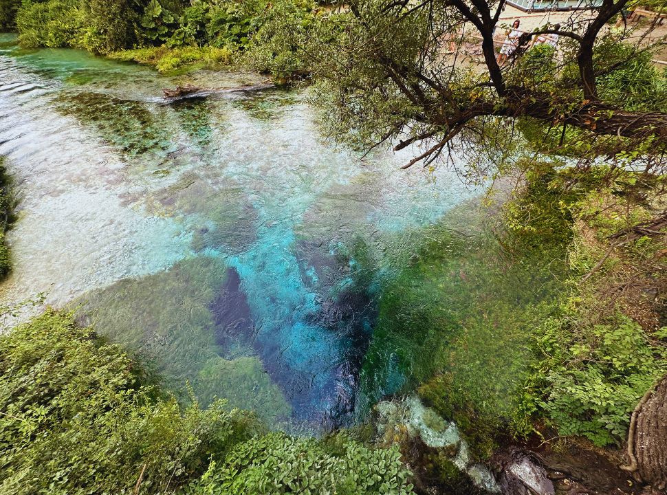 natural spring with various shades of blue and turquoise in Albania