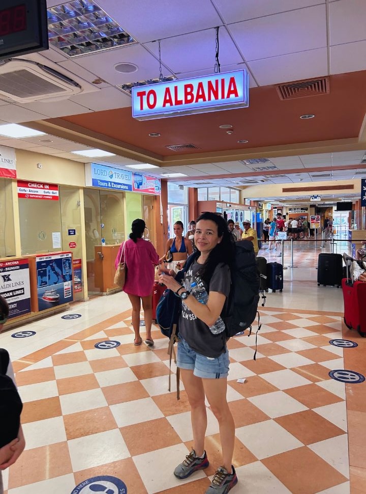 woman standing in the waiting area at Corfu Port Terminal