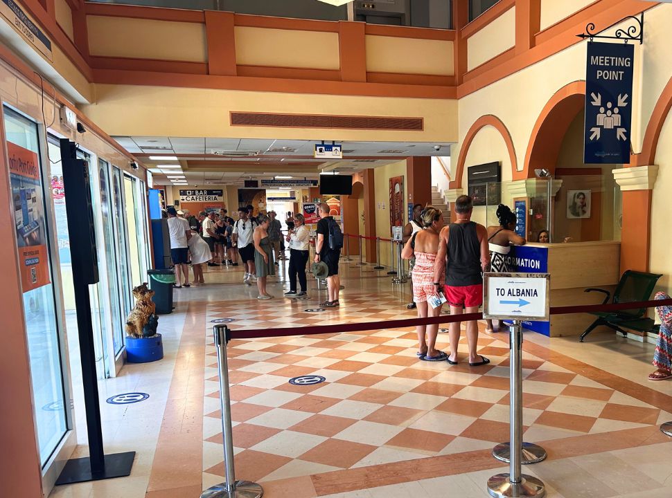 people standing in the waiting area of the Corfu Port Terminal