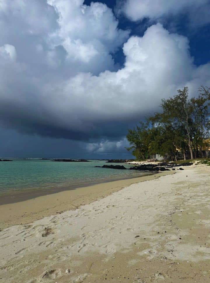 dark clouds visible in the distance at a tropical beach in Mauritius