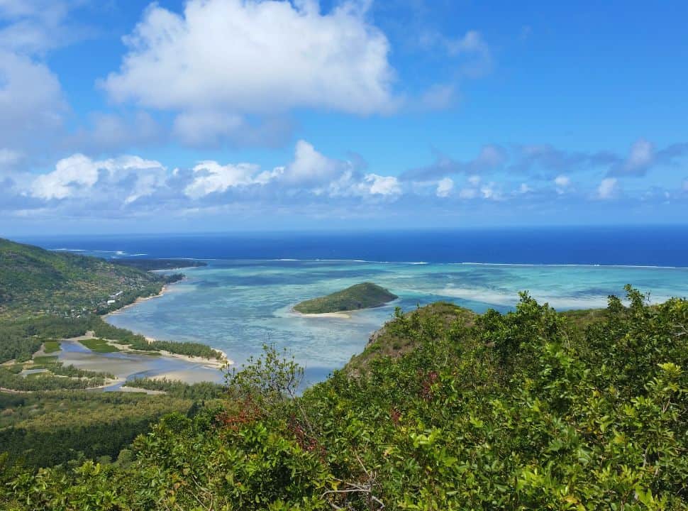 view of the famous lagoon near Le Morne mountain Mauritius, with it various shades and colors ranging from blue to turquoise. The coast line is covered with lush vegetation. 