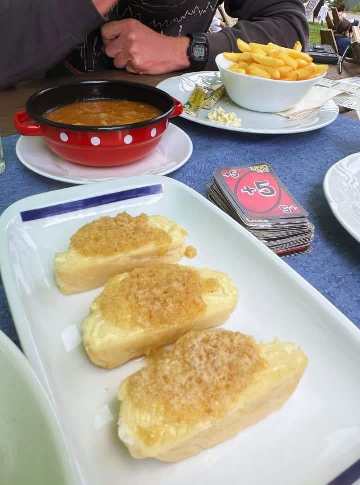 close up of traditional cheese dumplings, grated cheese on soft bread in Slovenia