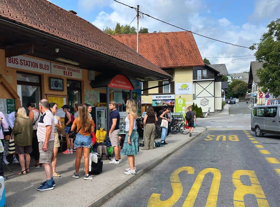 people waiting at a bus station in the popular tourist town Bled Slovenia