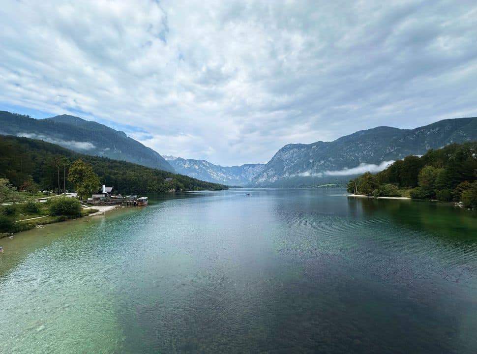 full view of lake Bohinj with in the distance a stunning mountain range
