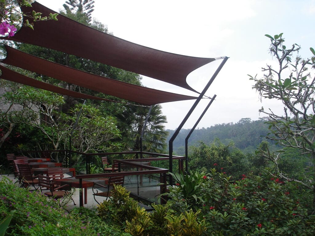 terrace set within a lush garden, above the tree tops with view of the jungle river gorge just outside Ubud center