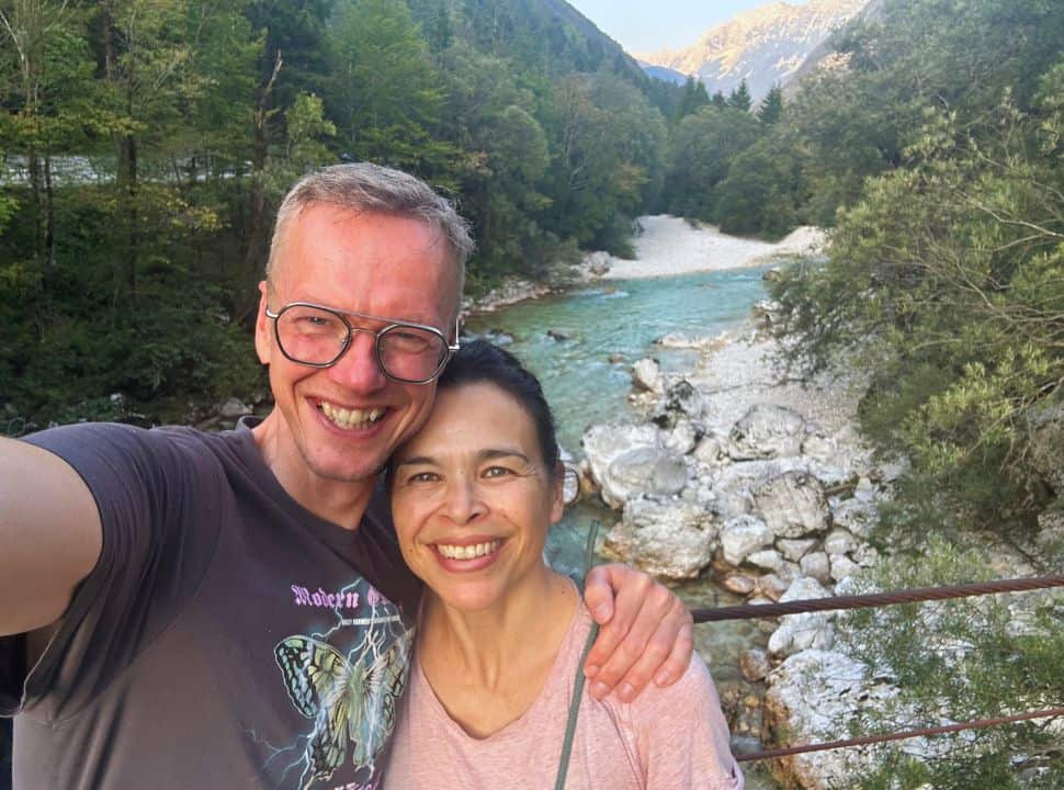 couple taking a selfie on a bridge above the soca river in Slovenia