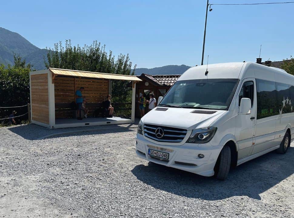 white van standing at a bus stop ready to leave from the parking area to the gorge in Tolmin Slovenia