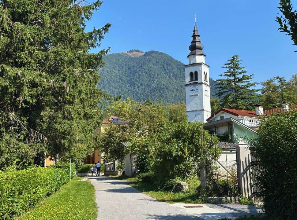 traditional slovenian church set within Tolmin village Slovenia, in the back mountslopes are visible. 