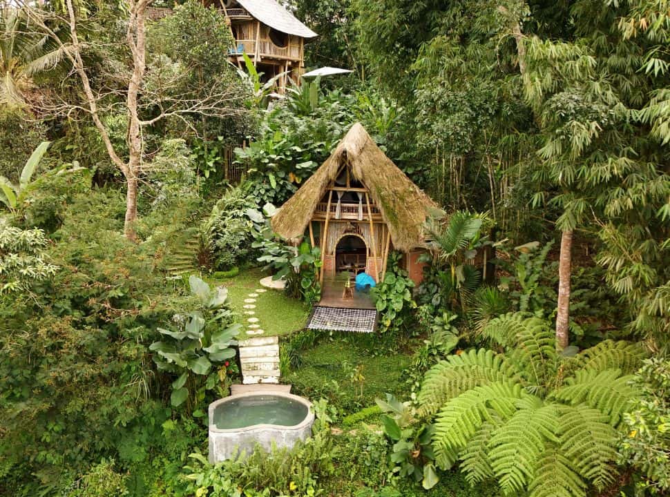 accommodation built with bamboo set within a green setting, almost jungle like with private little pool 