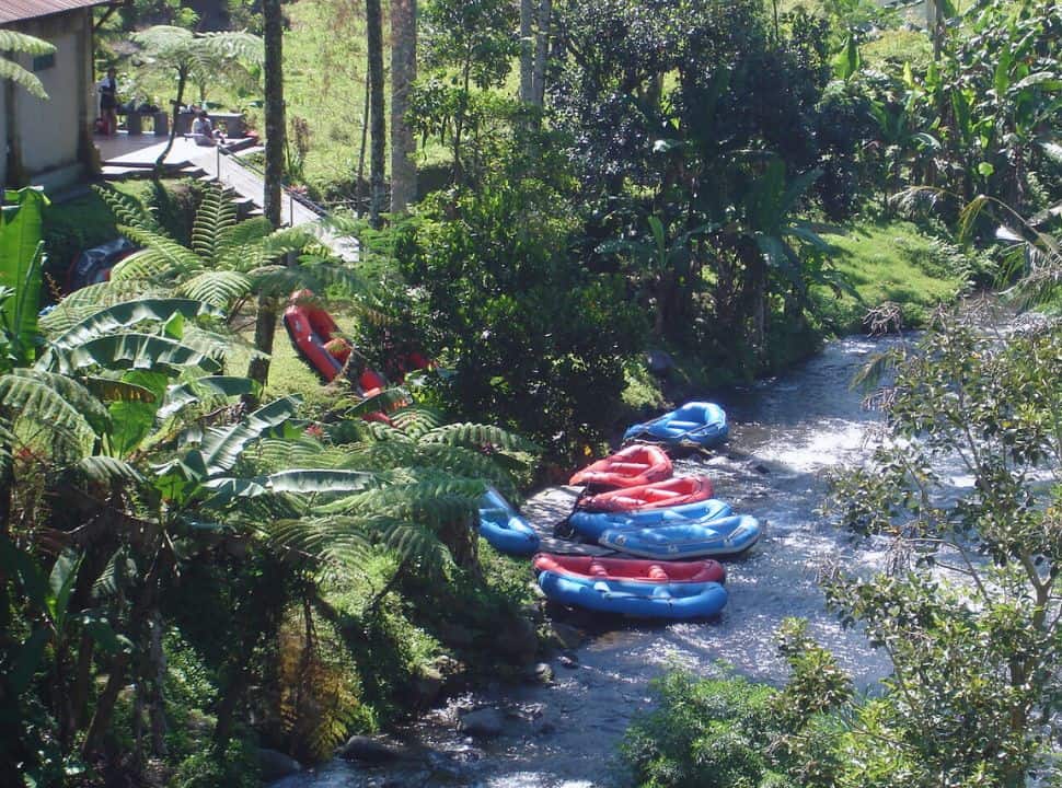 rafting boats tied up at the edge of the river nearby Sidemen