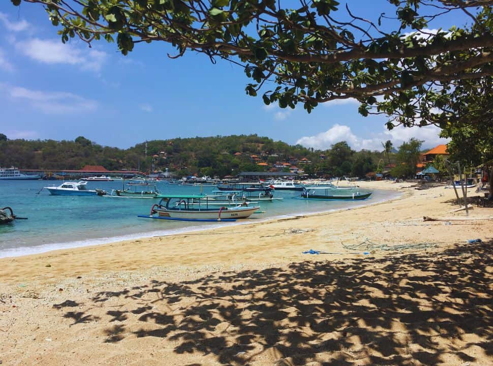 padangbai beach with many traditional Balinese fishing boats lying in the beach shore