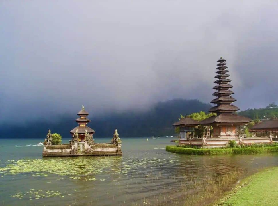part of the temole Ubud Beratan set on the lake, beautiful setting with water, misty mountain slopes in Bali