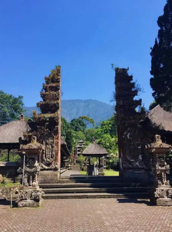 main entrance gate to the important temple Batukaru, between the gate entrance mount Baturkaru is visible. 