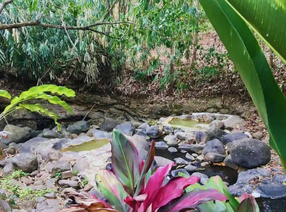 open-air natural hot springs near the river in Penatahan