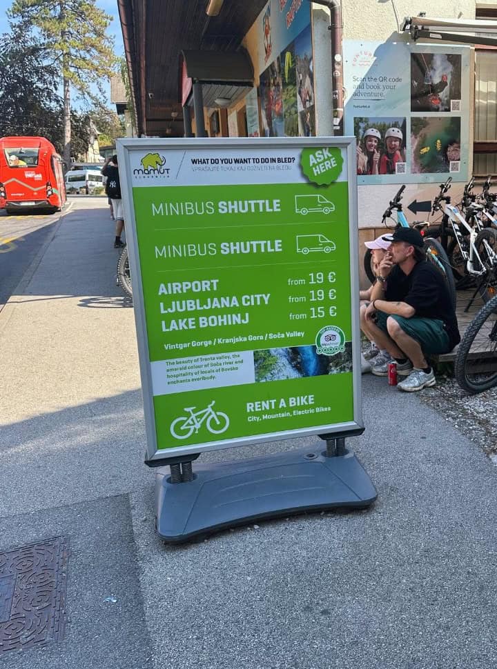 sign of a shuttle service between bled and Ljubljana, airport and lake bohinj near a rental company in Bled Slovenia