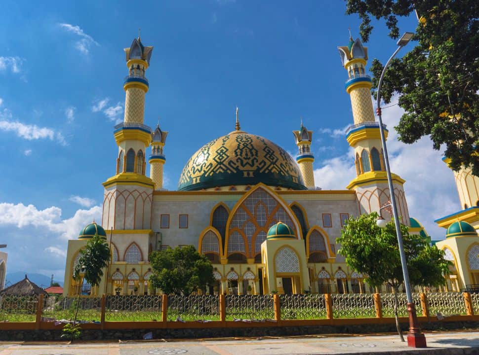 a yellow, white and blue mosque in Lombok island