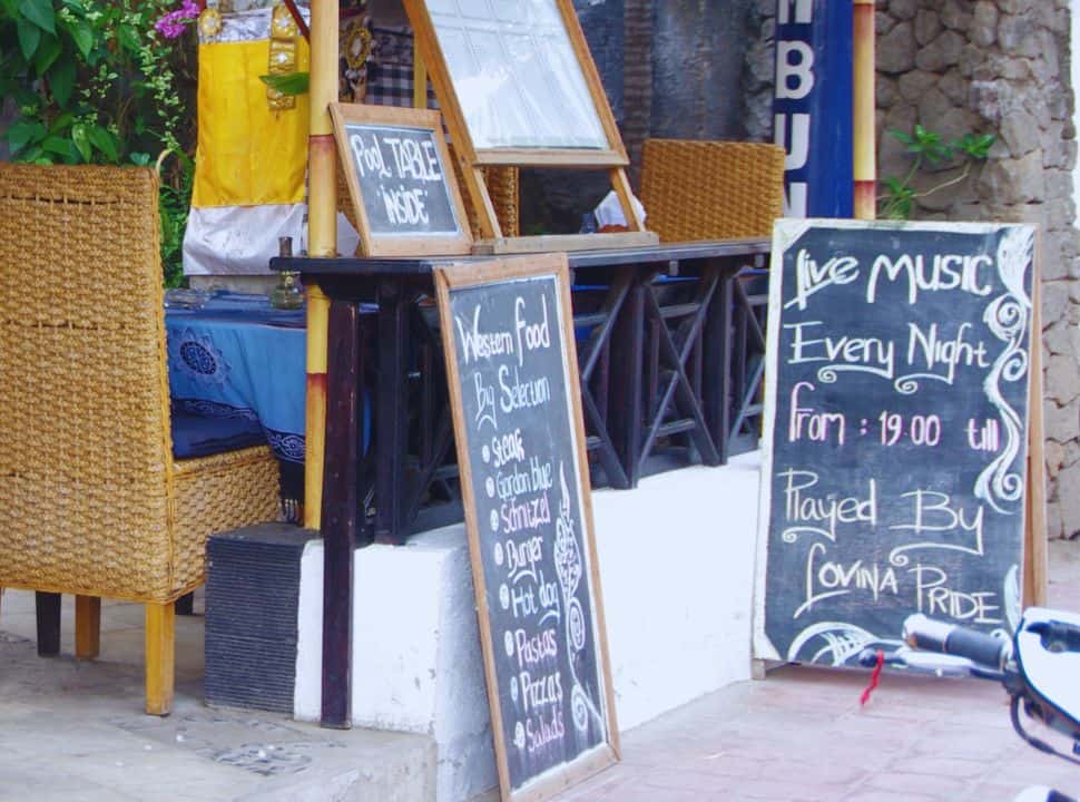 sign with live music every night from 19:00 at a restaurant in Lovina Beach Bali