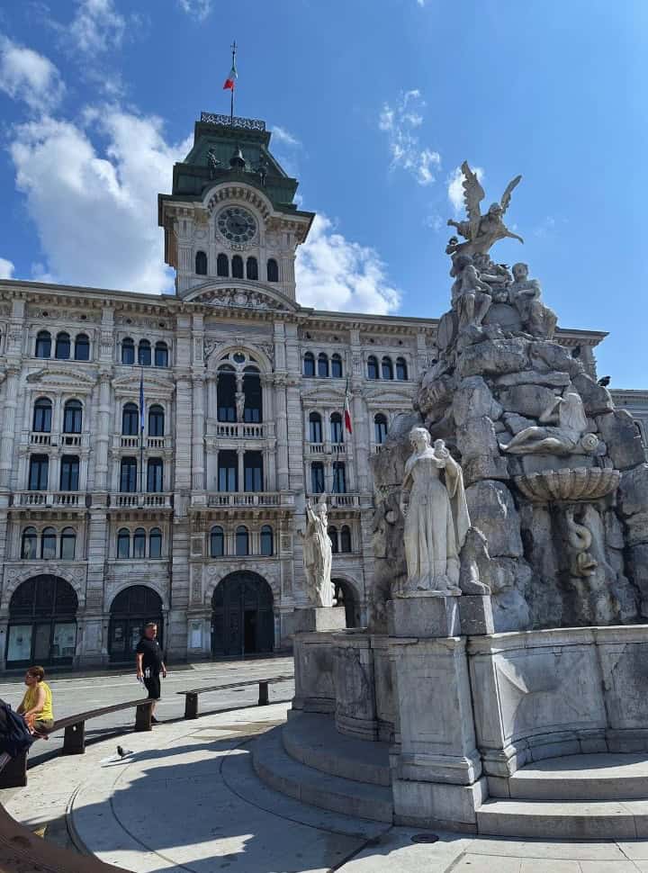 beautiful classic styled city hall with fountain in front at the Piazza Unità d'Italia in Trieste Italy