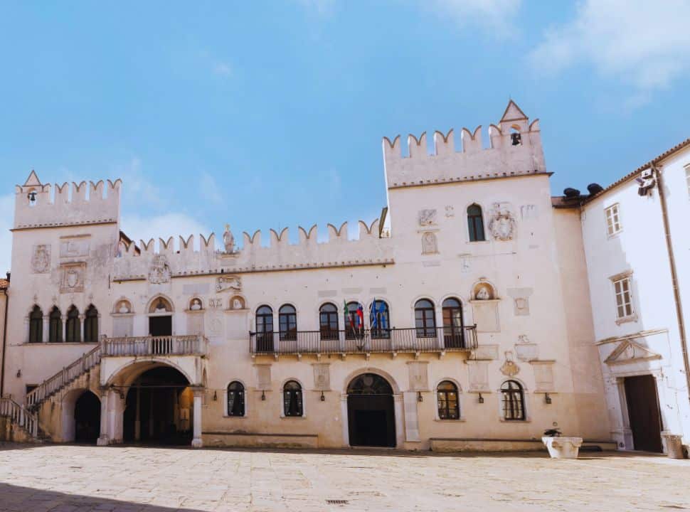 white palace building at a square in the old town of Koper Slovenia