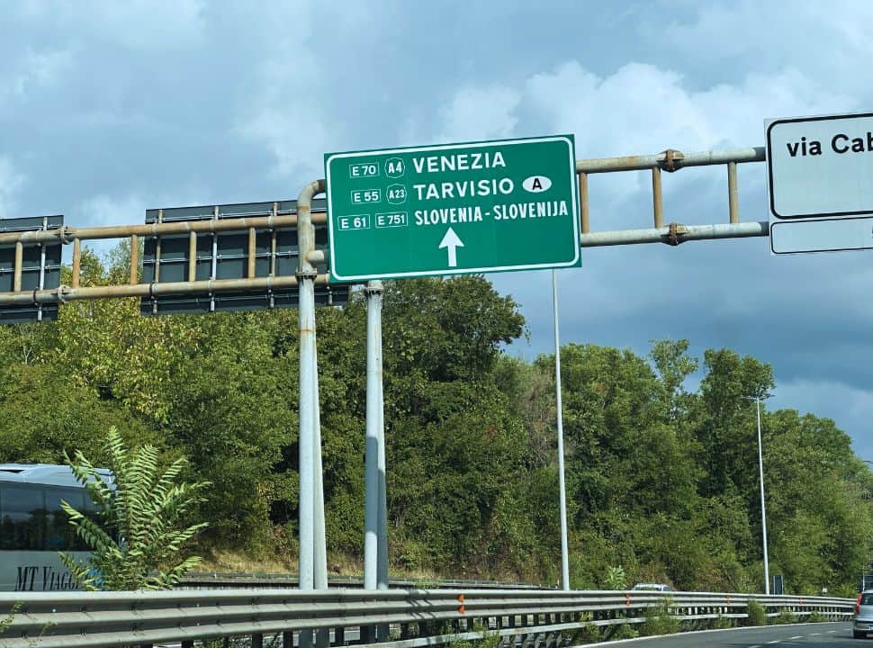 road sign the high way pointing towards Venice, Tarvisio and Slovenia